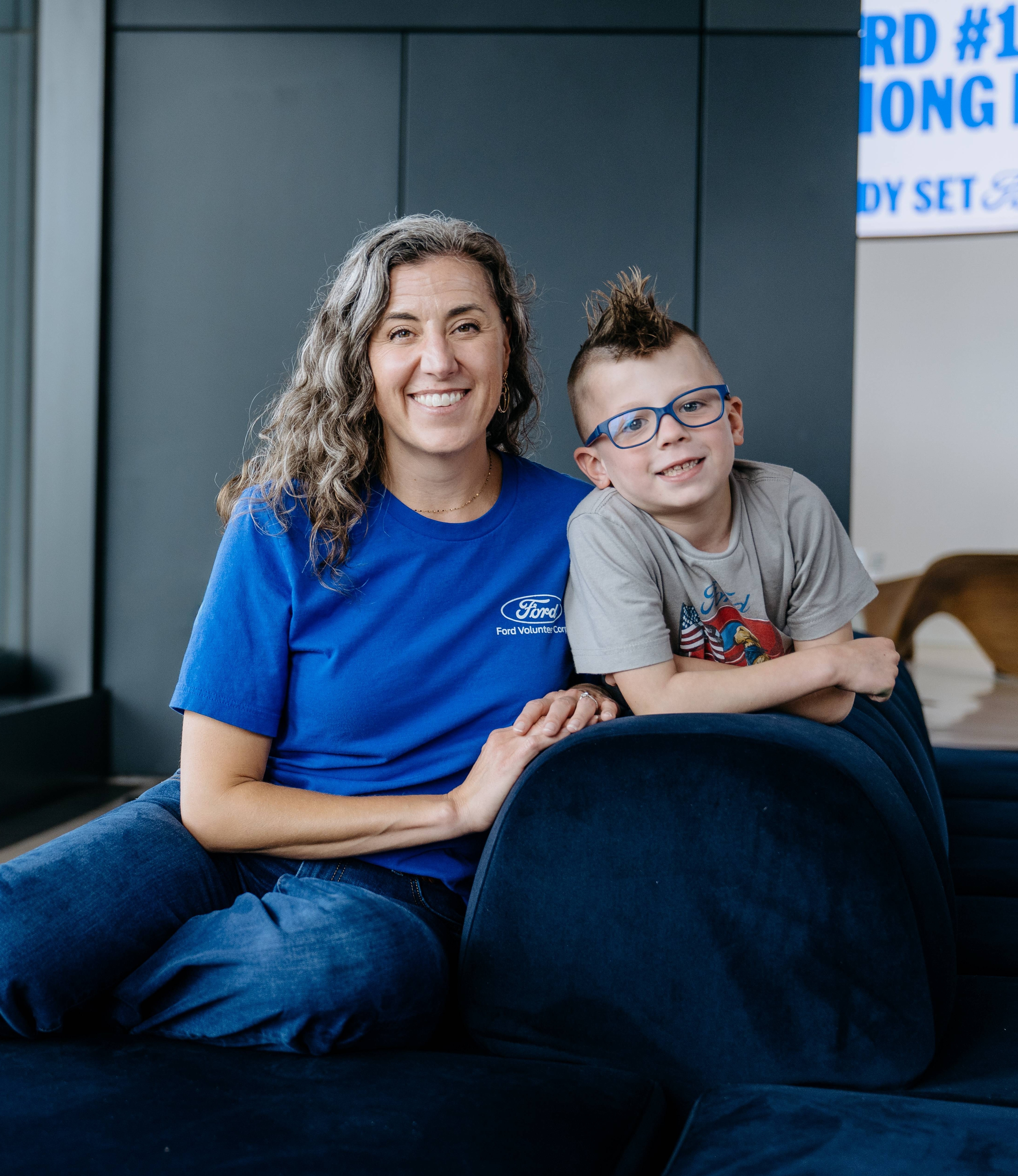 Ford Chief Futurist Jen Brace and her son Max organized Ford volunteers during Global Caring Month to assemble life-saving swab kits for the National Marrow Donor Program registry.